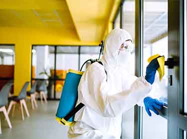 Disinfection of high-touch surfaces in a commercial office space.
