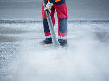 NYC commercial cleaning team removing dust and debris from a newly constructed office space.